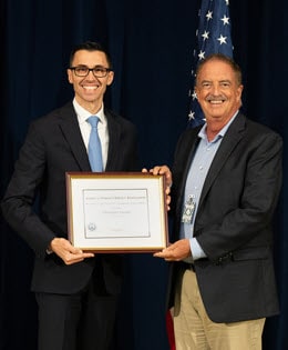 AFSA M. Juanita Guess Award winner, Christophe Paccard receives her award from Jon Clements.