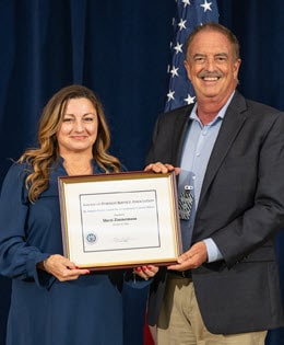 AFSA M. Juanita Guess Award winner, Sherri Zimmerman receives her award from Jon Clements.